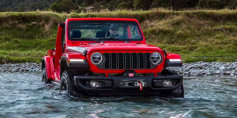 2024 Jeep Wrangler crossing a river