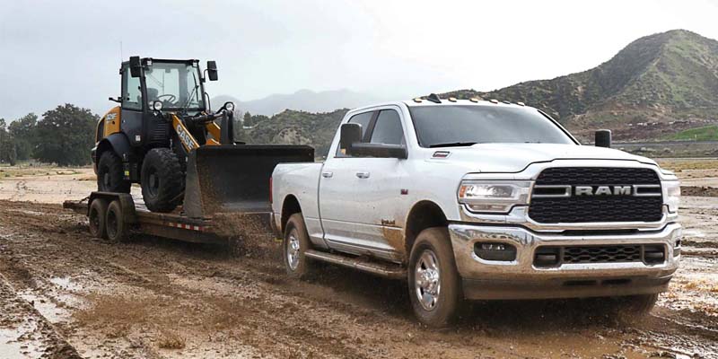 Ram 2500 towing Heavy Equipment